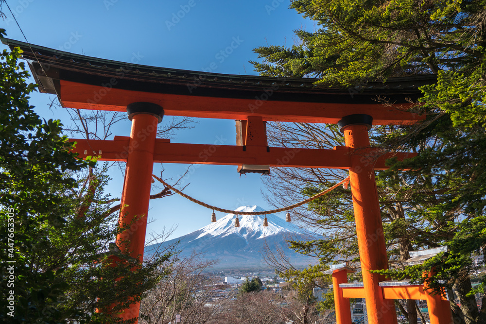 Mount Fuji View Through Red Japanese Torii Gate. Shinto Shrine and Chureito Pagoda in Arakurayama Sengen Park, Japan. Mount Fuji View Through Red Japanese Torii Gate. Shinto Shrine and Chureito Pagoda in Arakurayama Sengen Park, Japan.