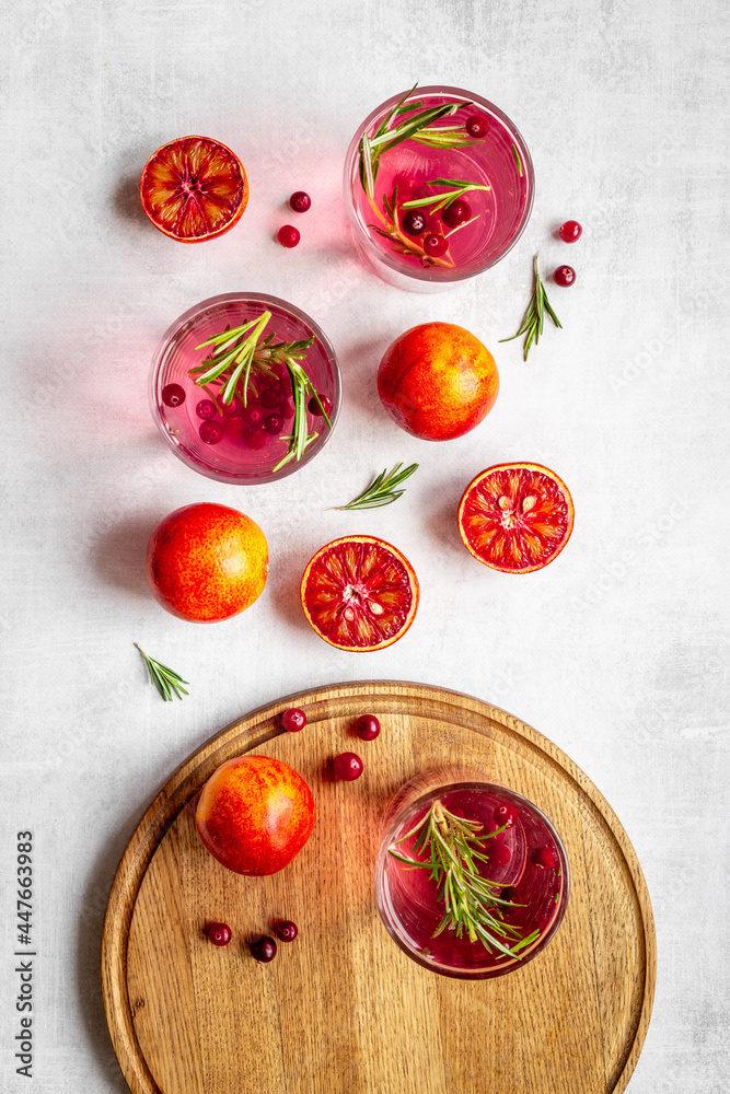 Red oranges refrashing drink lemonade with cranberry. Top view Red oranges refrashing drink lemonade with cranberry. Top view