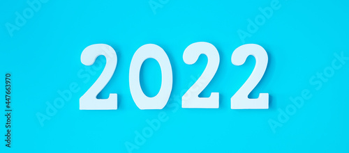 2022 white text number on blue background. Resolution, plan, review, goal, start and New Year holiday concepts
