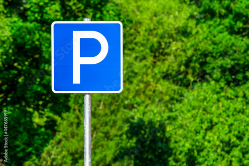 Parking sign on natural green background photo