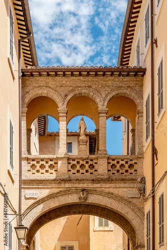 The ancient arch in Via del Seminario in the historic center of Spoleto, Italy  photo