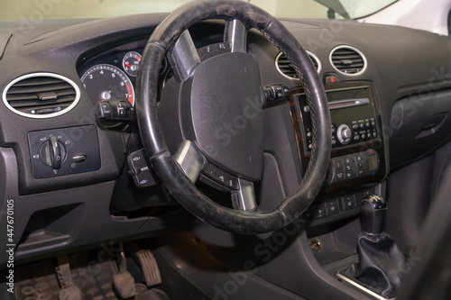 Car steering wheel in the dust inside the car, Car steering wheel replacement © yaroslav1986