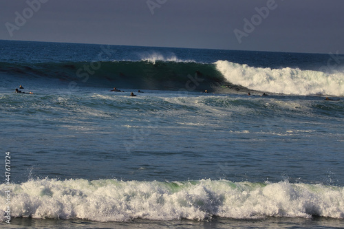 Surfing big summer waves at Leo Carrillo state beach