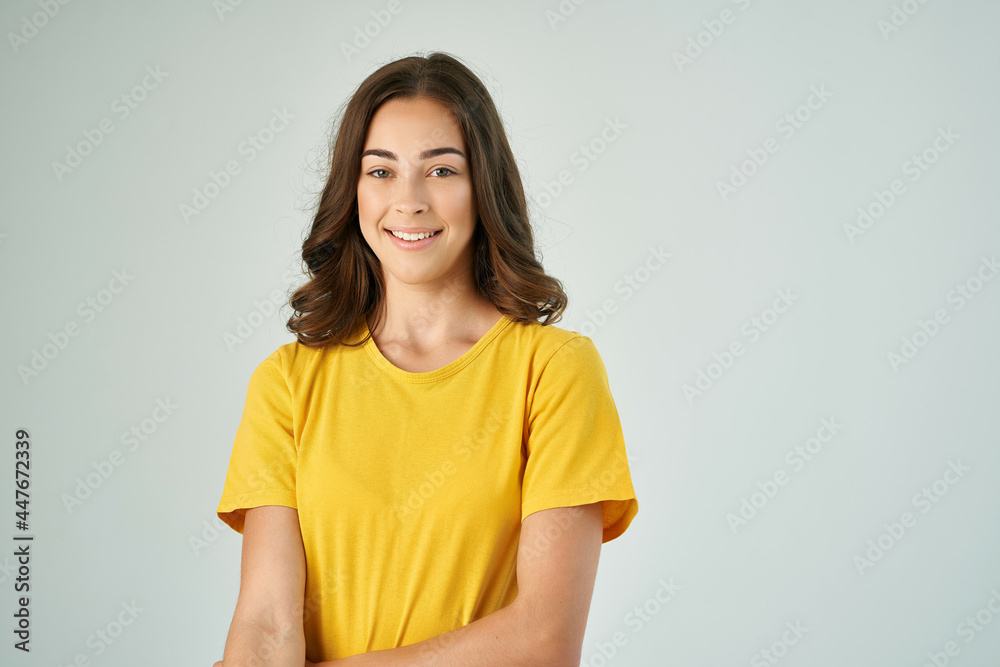 pretty brunette in yellow t-shirt smile posing lifestyle pretty brunette in yellow t-shirt smile posing lifestyle
