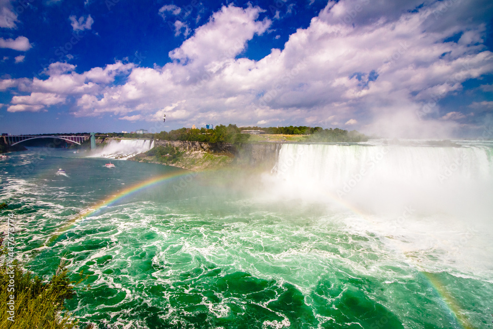 Niagara Falls in the day with spray and rainbow