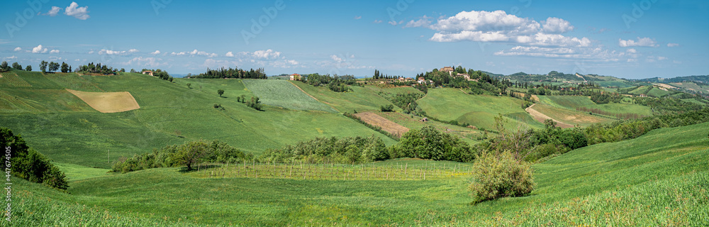The cultivated hills around Castello di Serravalle - Castle of Serravalle in springtime. Bologna province, Emilia and Romagna, Italy