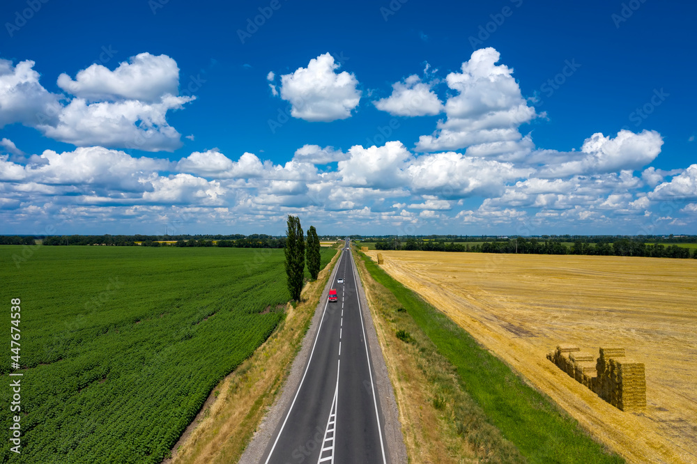 Grey asphalted narrow country road aerial view Grey asphalted narrow country road aerial view