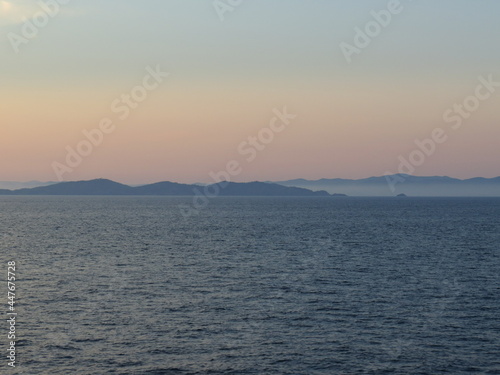 Sunrise over Corsica seen from the ferry © latrimouille