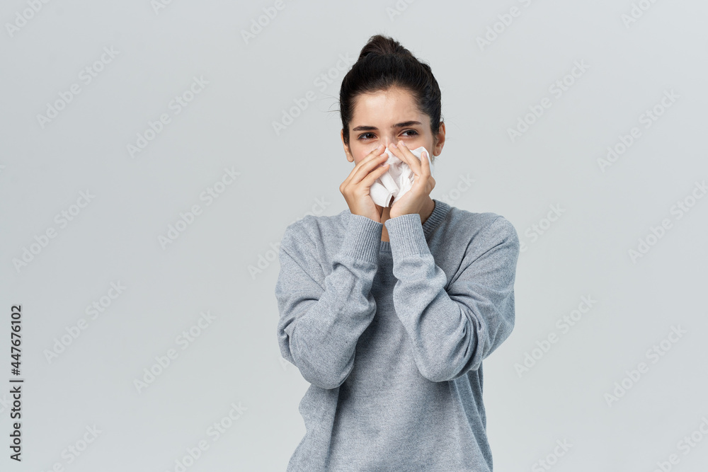 brunette wipes her nose with a handkerchief runny nose unhealthy look brunette wipes her nose with a handkerchief runny nose unhealthy look
