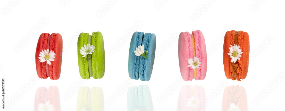 Colorful macaroons on white background. Food levitation concepts. Colorful macaroons on white background. Food levitation concepts.