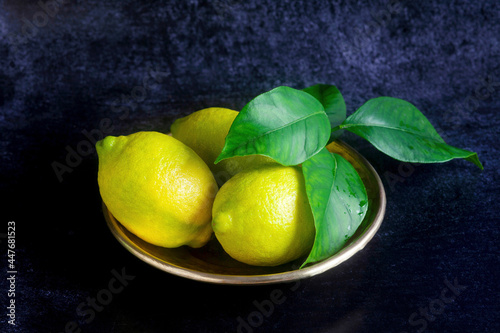 Lemons in a metal dish