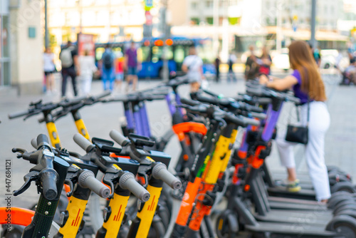 Electric scooters on the street of the city. Rental service.