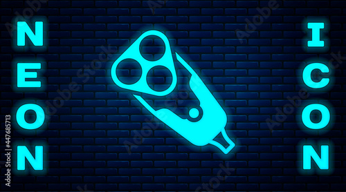 Glowing neon Electric razor blade for men icon isolated on brick wall background. Electric shaver. Vector