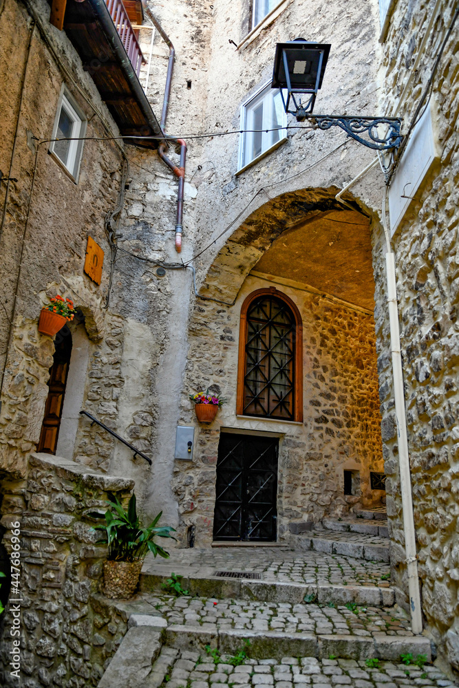 Naklejka premium Carpineto Romano, Italy, July 24, 2021. An arch at the entrance of a medieval town in the Lazio region.