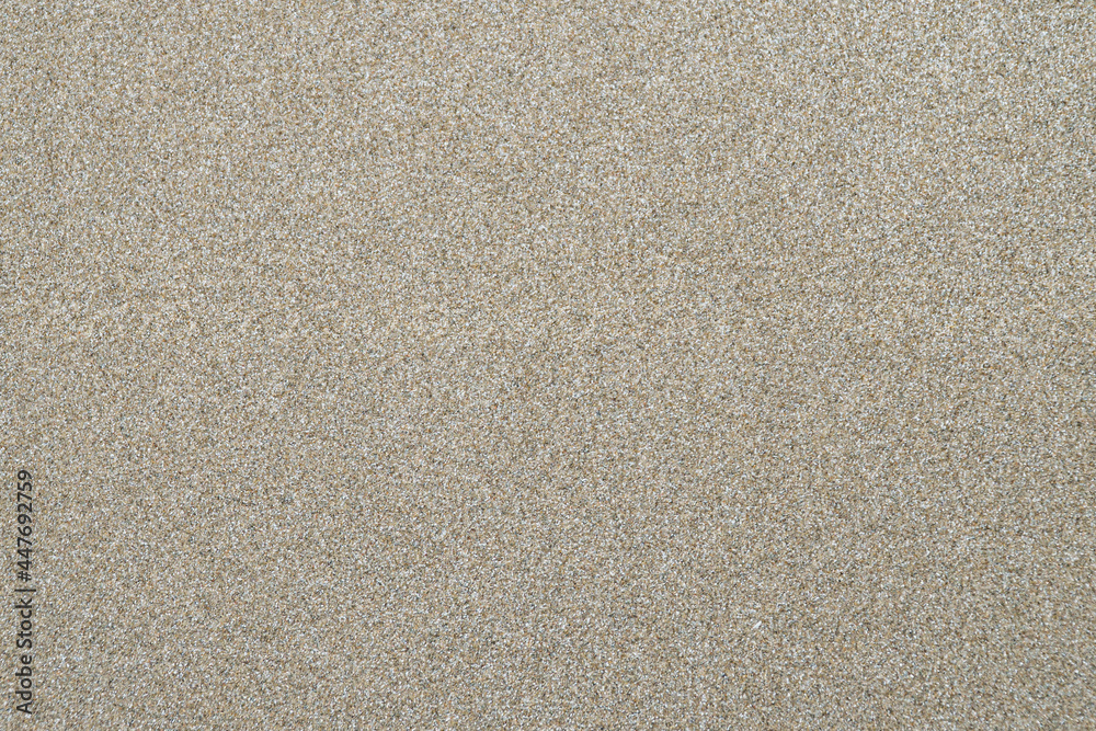 Fototapeta premium Wet sand surface texture at the beach.