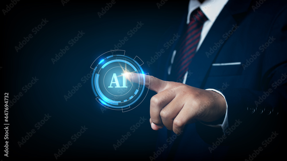 Businessman pointing spot on the AI(Artificial Intelligence) wording with the circle digital hi-tech technology circuit design background. concept innovation. Businessman pointing spot on the AI(Artificial Intelligence) wording with the circle digital hi-tech technology circuit design background. concept innovation.
