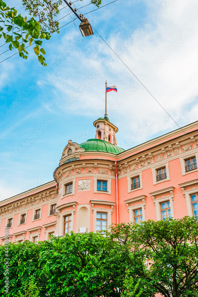 Fototapeta premium The beautiful facade of the Mikhailovsky Castle in the city center in summer. A tourist attraction. Saint Petersburg, Russia - 11 June 2021