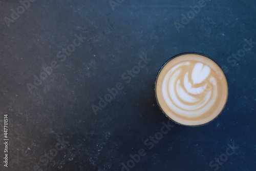 Creamy coffee cup top view. Mug of latte, cappuccino, milk and coffee glass on concrete table background. For coffee shop templates, cafe, morning concept