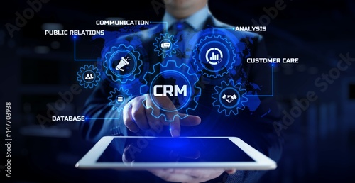 CRM Customer relationship management concept. Businessman pressing button on screen.