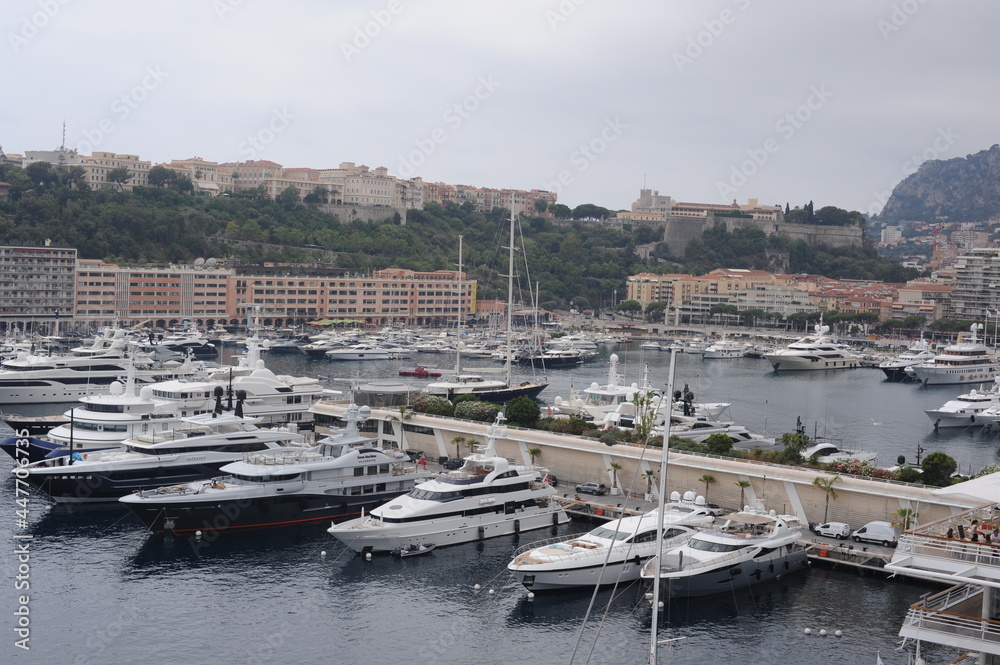 Panorama of Monaco harbour with yachts at Mediterranean Sea in summer on a cloudy day Panorama of Monaco harbour with yachts at Mediterranean Sea in summer on a cloudy day