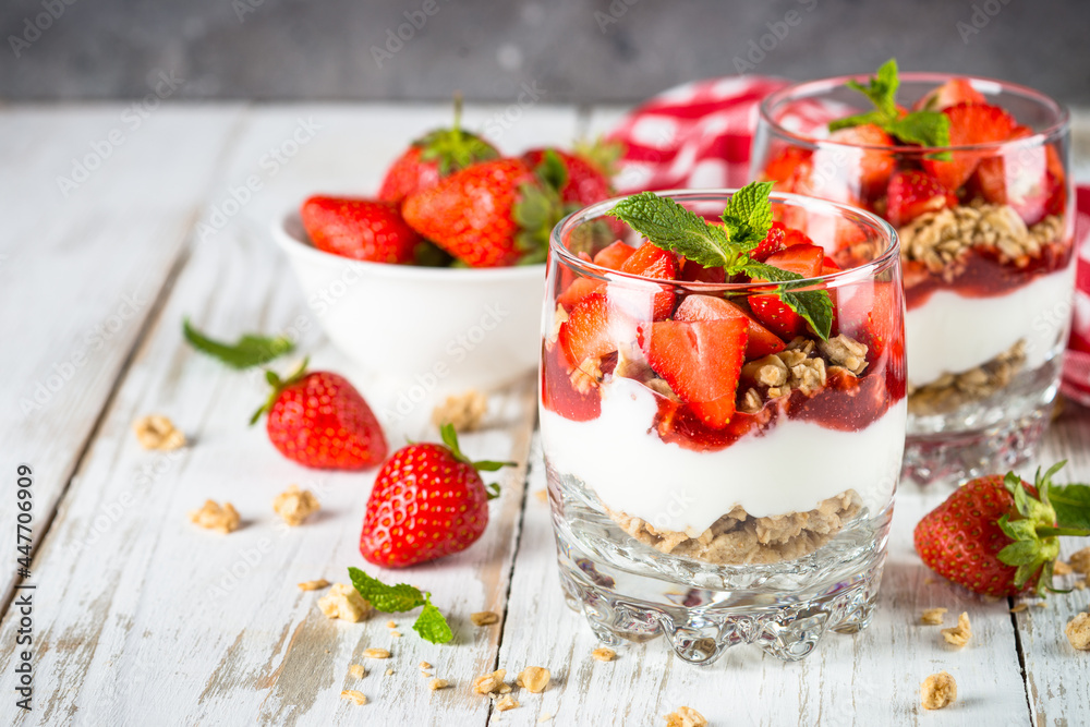 Greek yogurt with fresh strawberry and granola. Parfait.