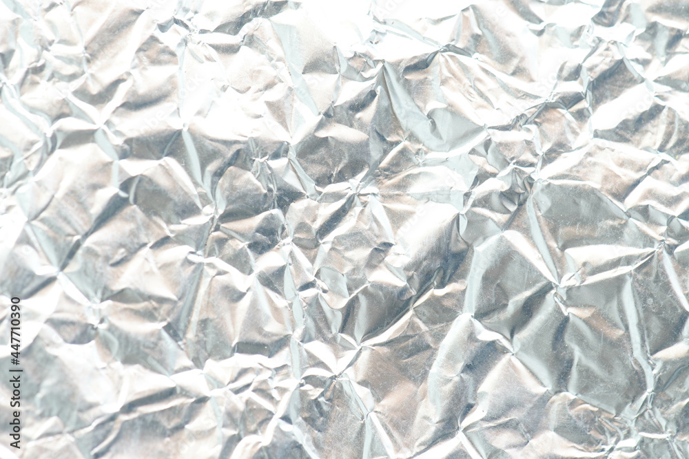 Obraz premium Crumpled metal foil texture background, aluminum foil texture