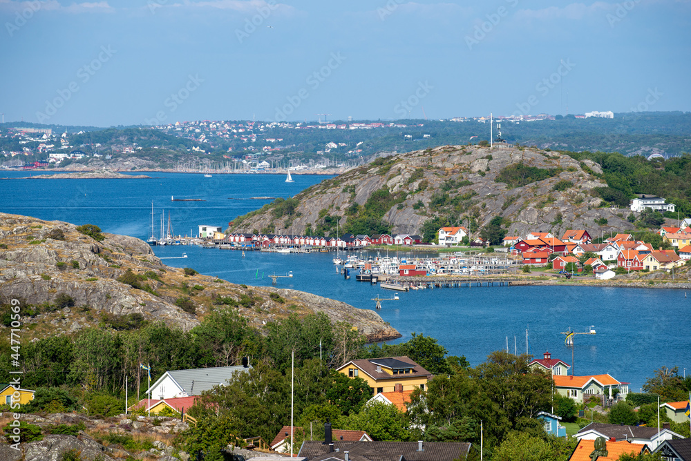 View over Swedish west coast archipelago and main land. Small fisherman harbor