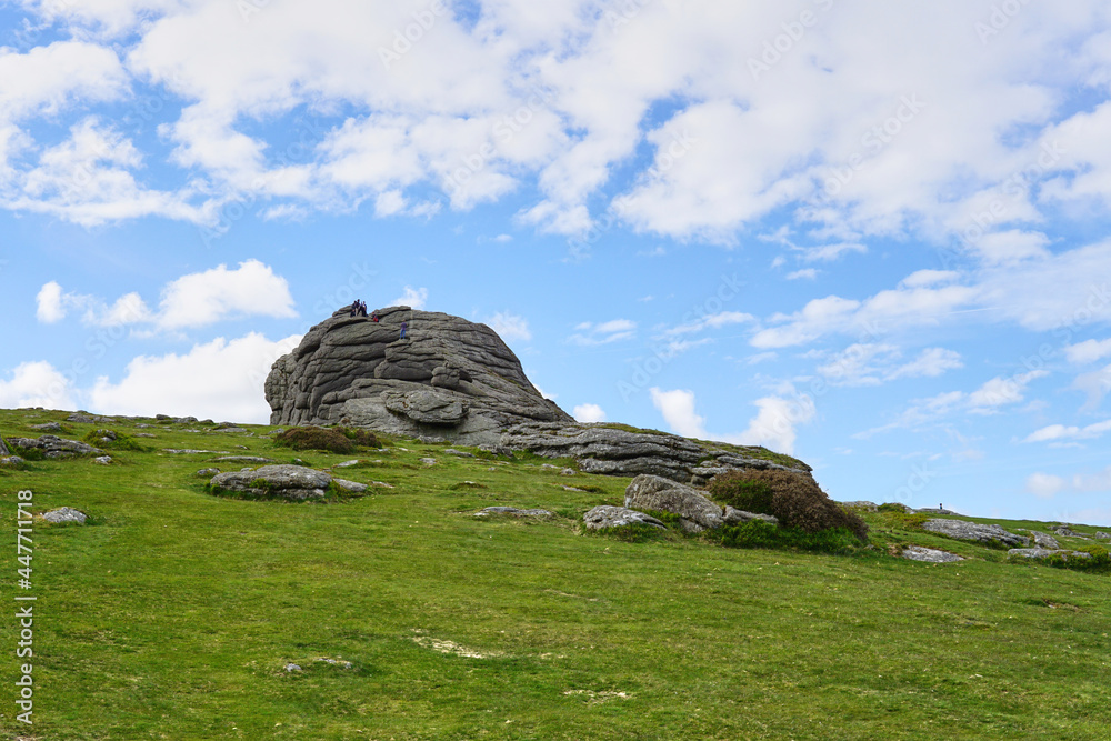 Haytor Rocks, Dartmoor's most famous landmark, is a granite tor on the eastern edge of Dartmoor in Devon, UK. sunny day.