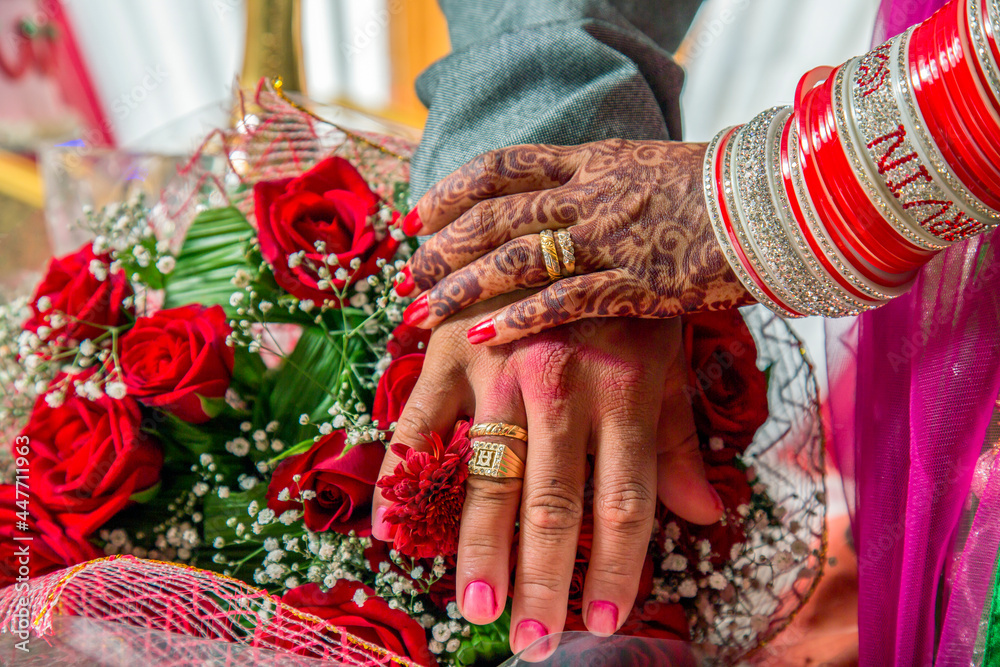wedding Rings on hands of  just married couple.