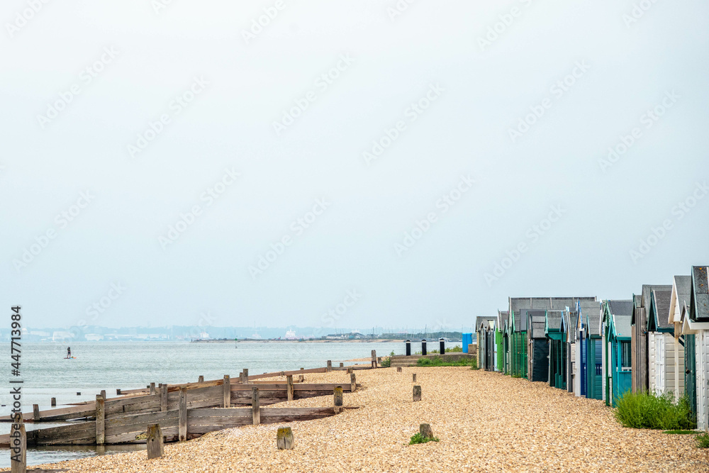 Fototapeta premium beach huts on the seashore in England