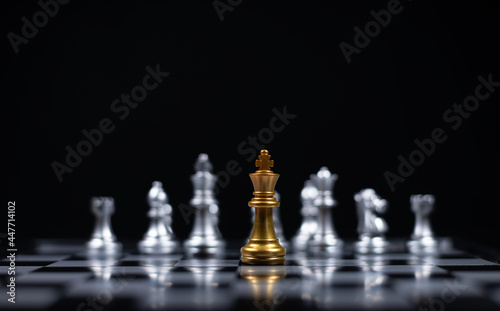 Chess board game between silver team and golden team is stategy game as business challange competitive game ,this business stategy plan concept.