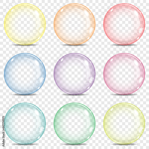 Nine big transparent glass sphere, bubble with a rainbow colors, yellow, orange, red, red-violet, violet, blue, blue-green, green, yellow-green, glares and shadow, on a plaid background.