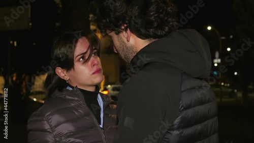 end of a love - girl rejects boyfriend who tries to be forgiven - night scene