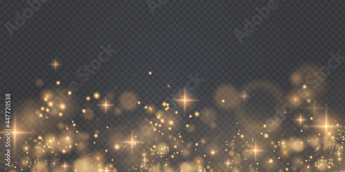 Gold sparkling dust with gold sparkling stars on a transparent background. Glittering texture. Christmas effect for luxury greeting rich card.	
