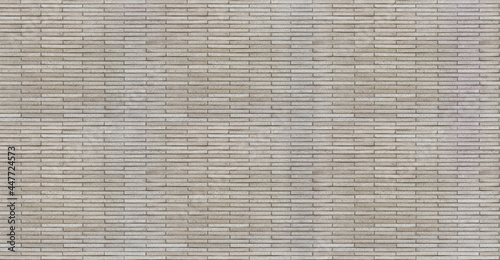 Photos Wall made of thin artificial stone bricks, seamless texture pattern
