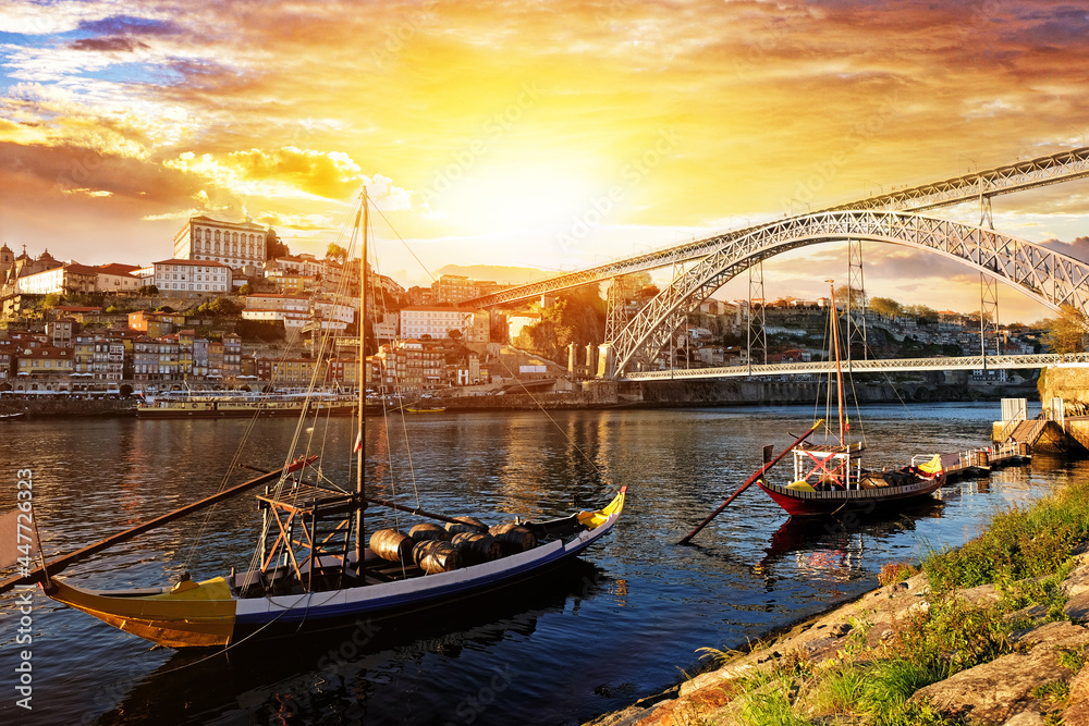 Porto, Portugal, Dom Luis bridge and boats on Douro River.