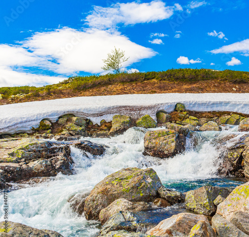 Beautiful Storebottane river vavatn lake with snow Hemsedal Norway. photo