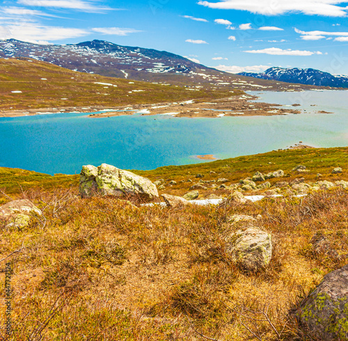 Amazing Vavatn lake panorama rough landscape snow mountains Hemsedal Norway. photo