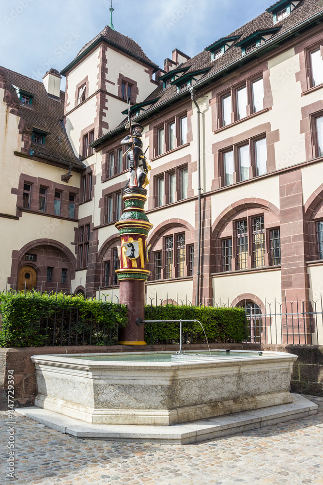 The Sevogel fountain on the Martinskirchplatz (Martin Church Square) built in 1400s, at the town certer of Basel, Switzerland