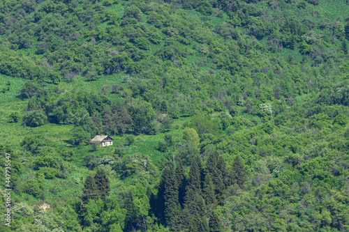 View of the old house on a slope in the mountains