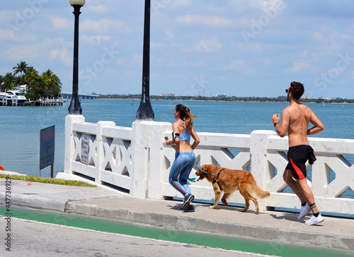 Sunday morning joggers on the Venetia Causeway in Miami Beach,Florida