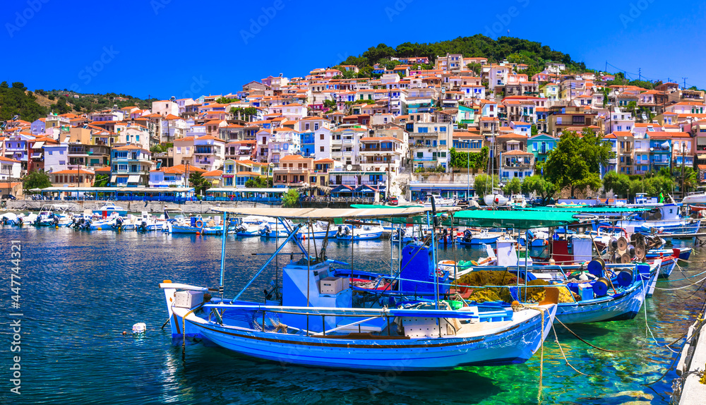 Traditional colorful Greece  - charming Plomari town. Fishing boats in the port, Lesvos island, Eastern Sporades