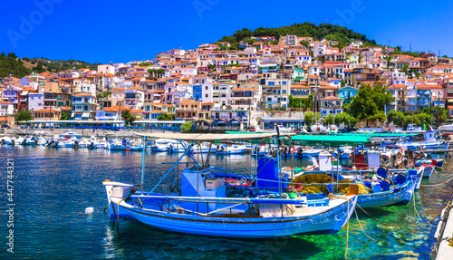 Traditional colorful Greece - charming Plomari town. Fishing boats in the port, Lesvos island, Eastern Sporades