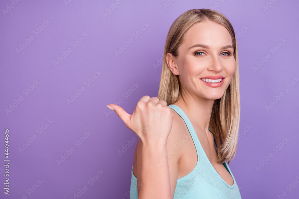 Profile photo of nice blond millennial lady point empty space wear blue top isolated on violet color background