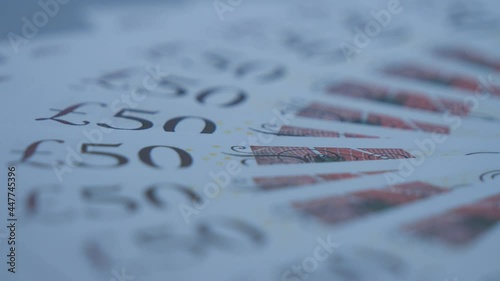 A close up view of 50 pound notes. photo