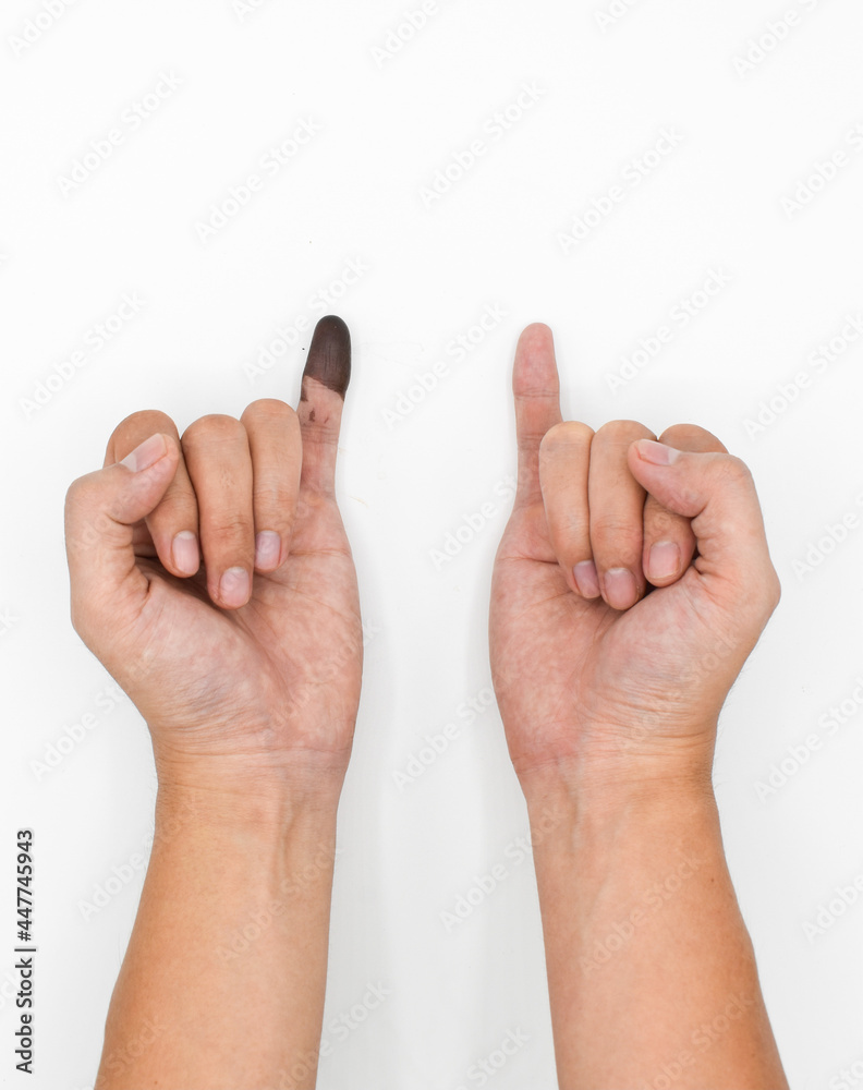 Blue ink mark in finger of man. Sign of voting in Myanmar election. Blue ink mark in finger of man. Sign of voting in Myanmar election.