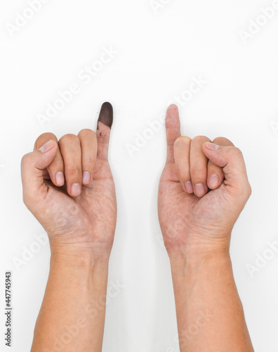 Blue ink mark in finger of man. Sign of voting in Myanmar election.