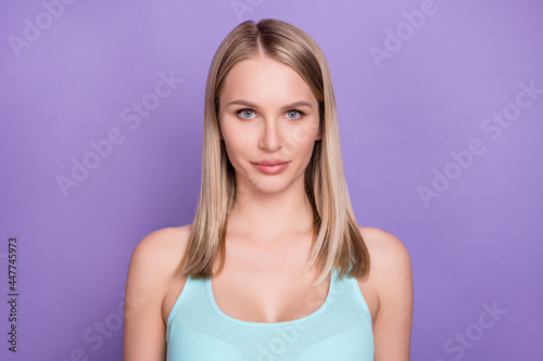 Photo of lovely blond millennial lady wear teal top isolated on violet color background
