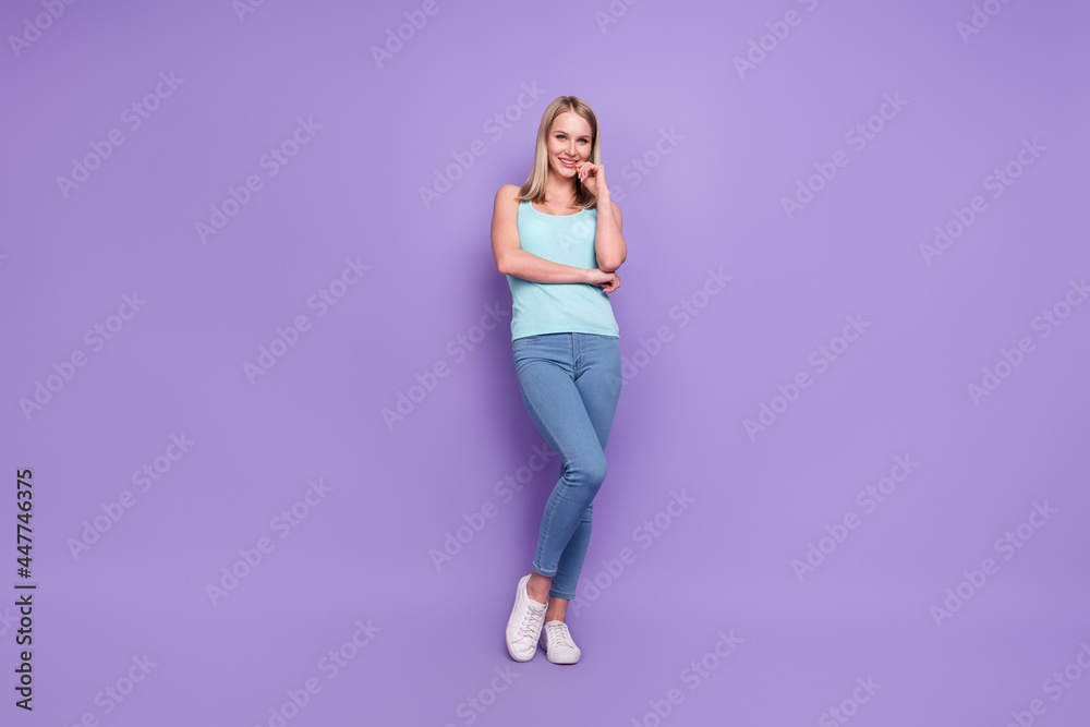 Full length body size photo blonde woman in casual clothes isolated pastel violet color background Full length body size photo blonde woman in casual clothes isolated pastel violet color background