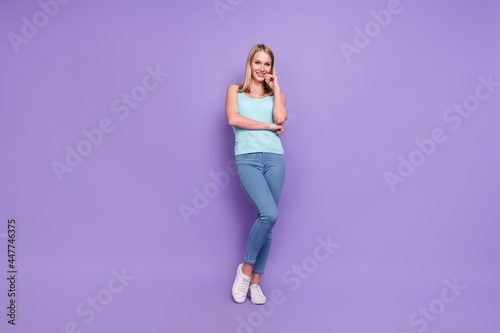 Full length body size photo blonde woman in casual clothes isolated pastel violet color background